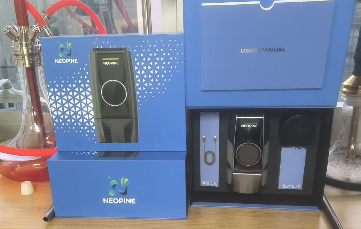 NEOPINE Pro 2026 boxes and user manual unpacked on a table