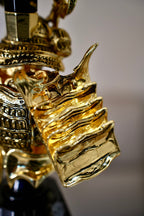 NEOPINE Warrior Hookah angled close-up of ribbed gold armour and engraved band